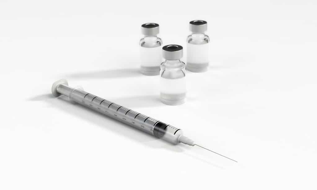 syringe with vials of liquid